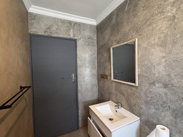 Bathroom with textured feature walls and vanity basin