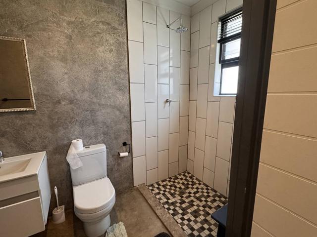Shower room with checkered floor tiles